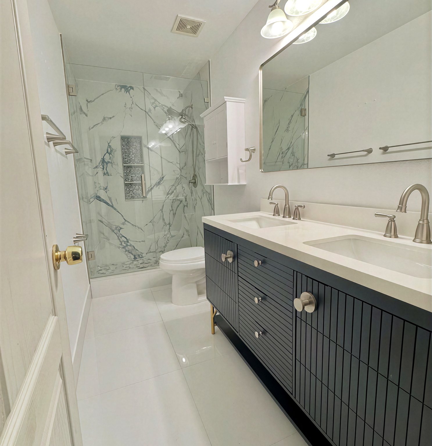 Navy fluted double vanity with white marble shower