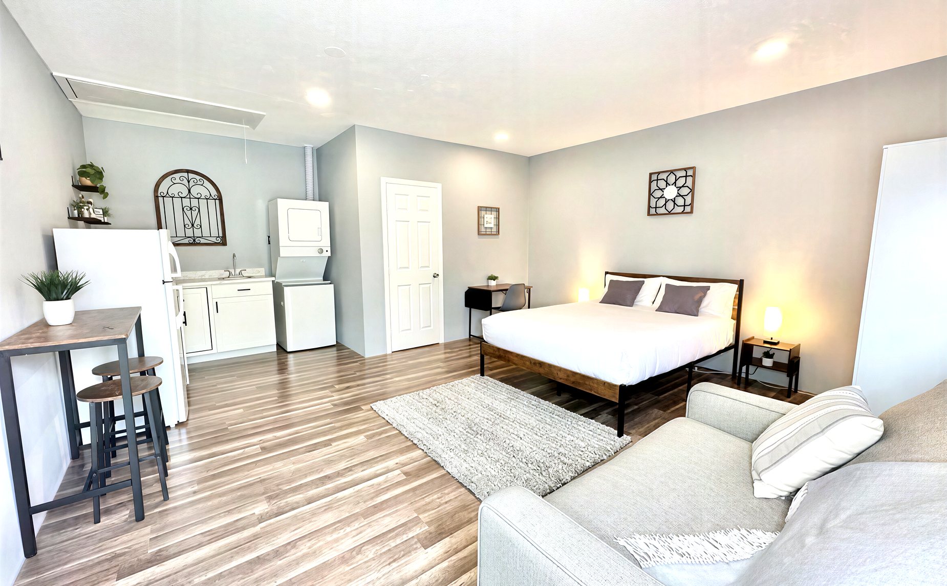 Garage converted into a finished efficiency with bed and kitchen