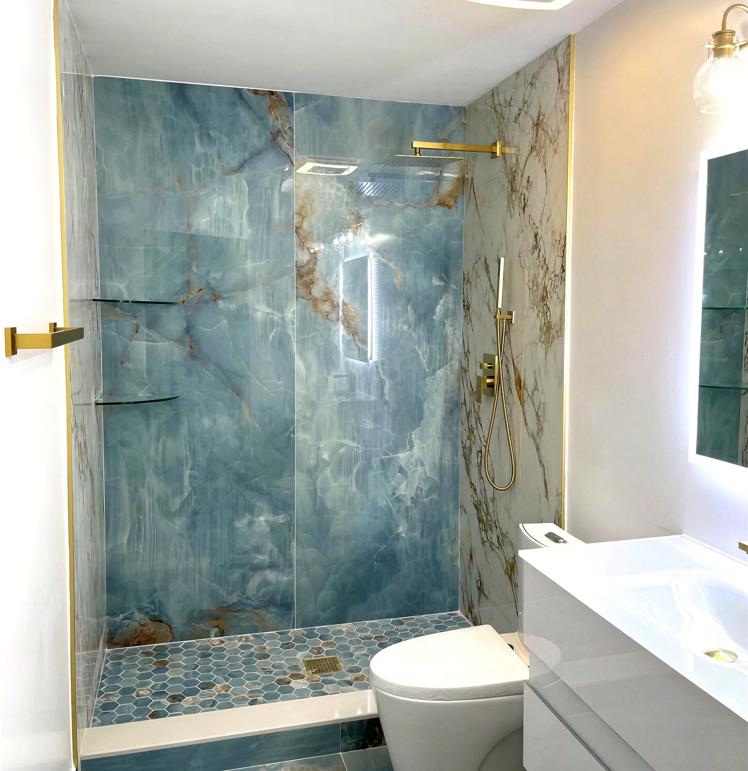 Blue onyx and calacatta marble shower with gold rain head